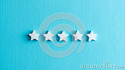 5 star rating customers satisfaction, white stars on light blue background Stock Photo