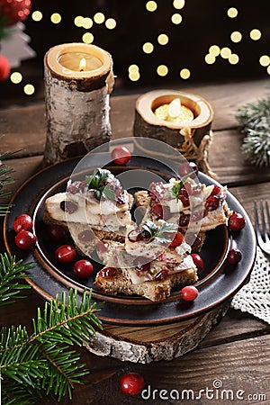 Star shaped canapes with herrings and cranberries for Christmas Stock Photo