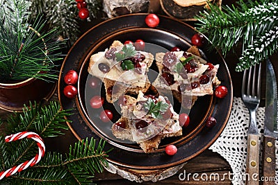 Star shaped canapes with herrings and cranberries for Christmas top view Stock Photo