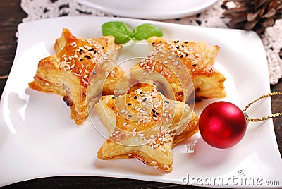 Star shaped puff pastries with mushroom fiiling for christmas Stock Photo
