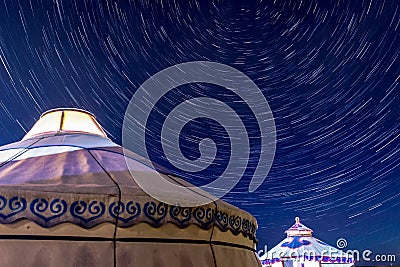 Star trails and yurts Stock Photo