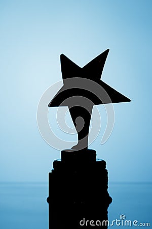 Star trophy silhouette, blue background Stock Photo