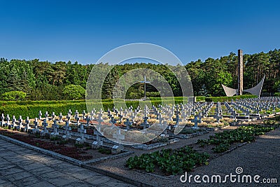 Monument and rows of graves. Military cemetery for fallen soldiers from 1st Polish Army Editorial Stock Photo