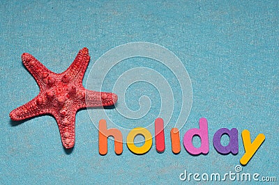 A starfish displayed with the word holiday Stock Photo