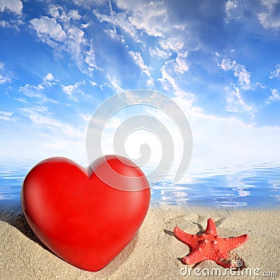 Starfish with heart on beach Stock Photo