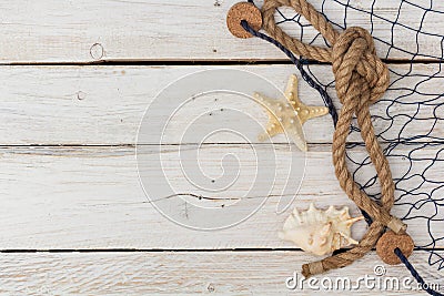 Starfish, marine network and rope on the old board Stock Photo