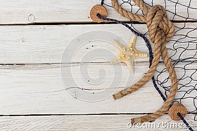 Starfish, marine network and rope on the old board Stock Photo