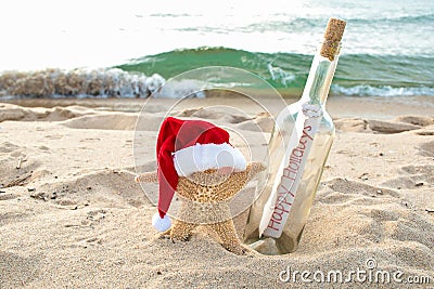 Santa starfish with message in a bottle Stock Photo