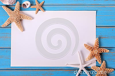 Starfish seashore paper poster frame old weathered blue beach wood deck Stock Photo