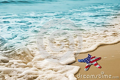 Starfish with USA flag on the sandy beach for Labor day concept Stock Photo