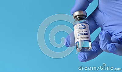 STARIY OSKOL, RUSSIA - NOVEMBER 23, 2020: Coronavirus prevention and protection concept and Pfizer vaccine in gloved Editorial Stock Photo