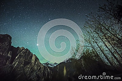 Starry green sky above high mountains on winter night Leh Ladakh India Stock Photo