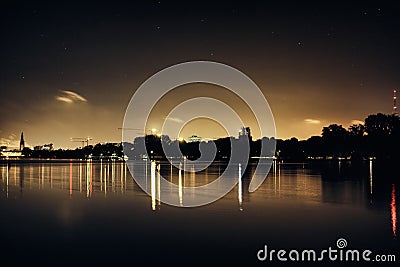 Stars black Alster Lake in Hamburg Germany duck famous city park dramatic rowing sailing panorama sky night cloud Stock Photo