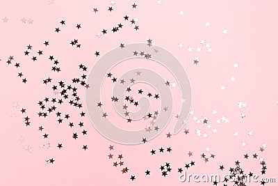 Stars confetti scattered on pink pastel background Stock Photo