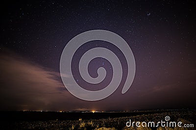 Stars over Galway and lighthouse Stock Photo