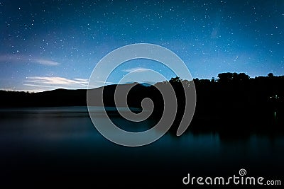 Stars over Julian Price Lake at night, along the Blue Ridge Park Stock Photo