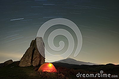 Stars Trails On Lighting Tent In Argimusco Highland, Sicily Stock Photo