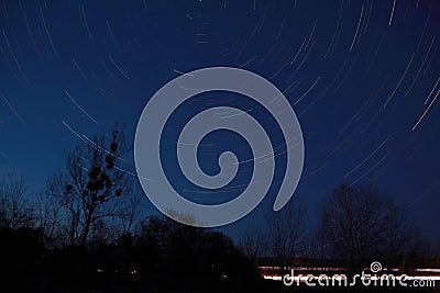 Stars trails on night sky Stock Photo