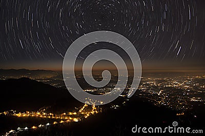 Stars trails and city Stock Photo