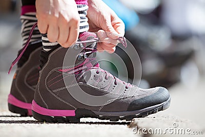 Start a business. Tie your shoes and go. Starting ready concept. Stock Photo