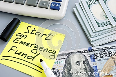 Start an Emergency Fund. Money and calculator Stock Photo
