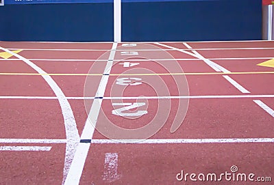 The start and finish line at an indoor track Stock Photo