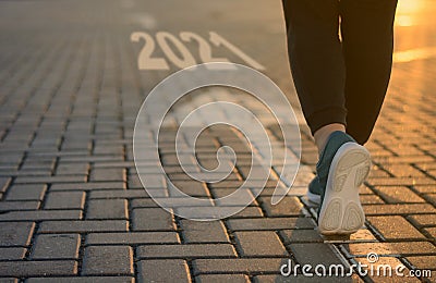 2021 start goal forward business concept. New Year 2021 movement to success, victory, career change. feet on arrow in Stock Photo