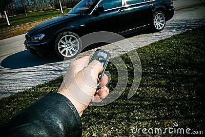 Start key of BMW 750 in a male hand Editorial Stock Photo