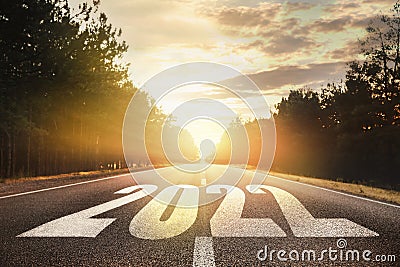 Start new year with fresh vision and ideas. 2022 numbers on asphalt road Stock Photo