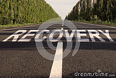 Start to live without alcohol addiction. Word RECOVERY on asphalt highway Stock Photo