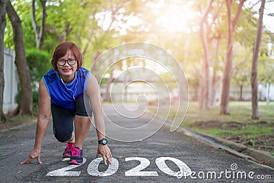 Start to new year 2020 plans goals Healthy way of life Senior asian woman happy jogging running Stock Photo