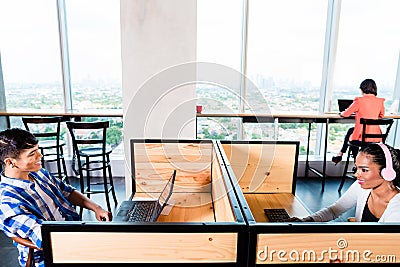 Start-up business people in coworking office Stock Photo