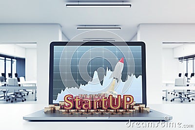 Start up, laptop with graph, office table Stock Photo