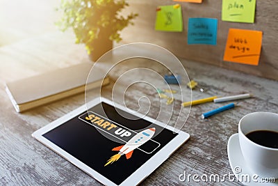 Start up spaceship on device screen. Business and finance concept. Stock Photo