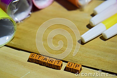 Start up on wooden cubes with colorful paper and pen, Concept Inspiration on wooden background Stock Photo