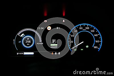 Starting electric car Dashboard. Track in to the button. Finger press the button to start the car engine. Car dashboard Stock Photo