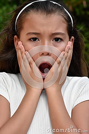 A Startled Philippina Girl Youth Closeup Stock Photo