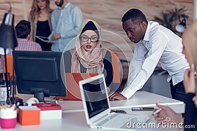 Startup business people group working everyday job at modern office. Tech office, tech company, tech startup, tech team. Stock Photo