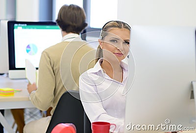 Startup business, young beautiful woman as software developer working on computer at modern office Stock Photo