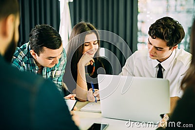 Startup diversity teamwork brainstorming meeting concept. business team coworkers working together at laptop. People working plann Stock Photo