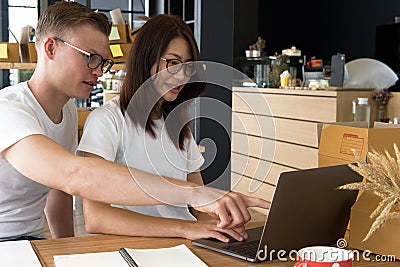 Startup small business owner working with computer at workplace. Stock Photo