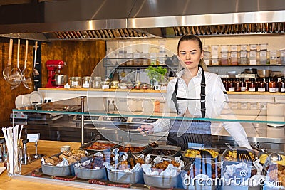 Startup successful small business owner woman working behind counter, Young entrepreneur or waitress serving food, Stock Photo