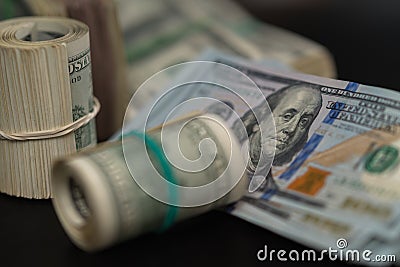 Stash of illegal money tied in rolls and wads Stock Photo