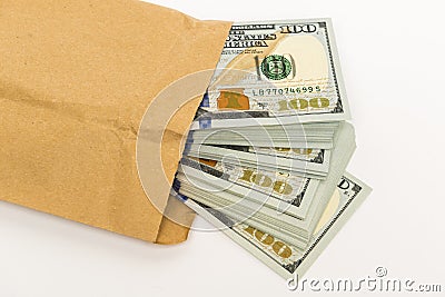 Stash of money in hundred dollar banknotes coming out of envelope Stock Photo