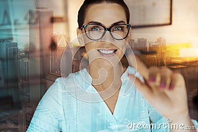 Cheerful woman touching an interactive screen Stock Photo