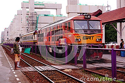 State Railways of Thailand SRT orange diesel electric train locomotive parked at Donmuang railway station Editorial Stock Photo