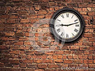 Station Clock On A Red Brick Wall Stock Photo