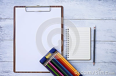 Stationary concept, blank notebook and blank paper on wood clipboard Stock Photo