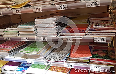 Stationery and notebooks for the new school year in the store and customers Editorial Stock Photo