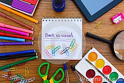 Stationery objects. Office and school supplies on the table. Caption: back to school. Stock Photo